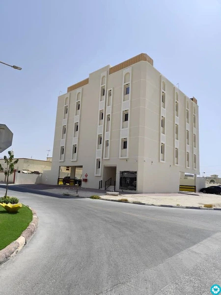 For rent, a building in Al-Khor, 13 apartments, and parking spaces. - 1/8