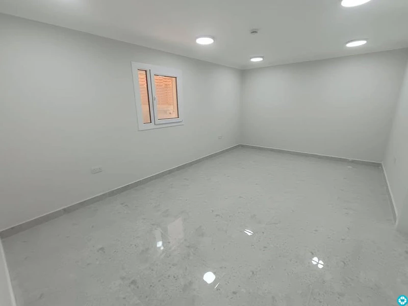 For rent, a building in Al-Khor, 13 apartments, and parking spaces. - 6/8